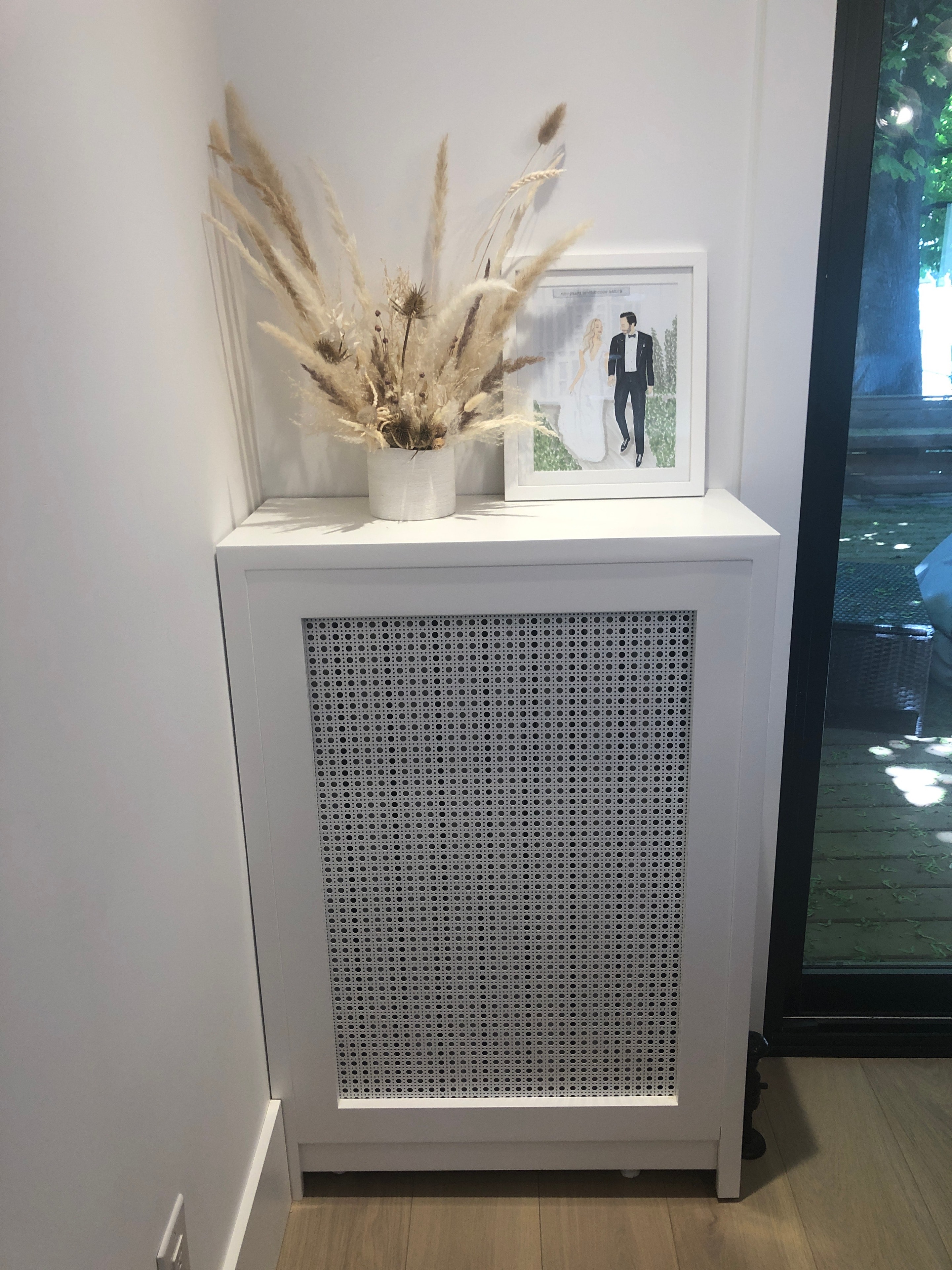 White cabinet with decorative home styling