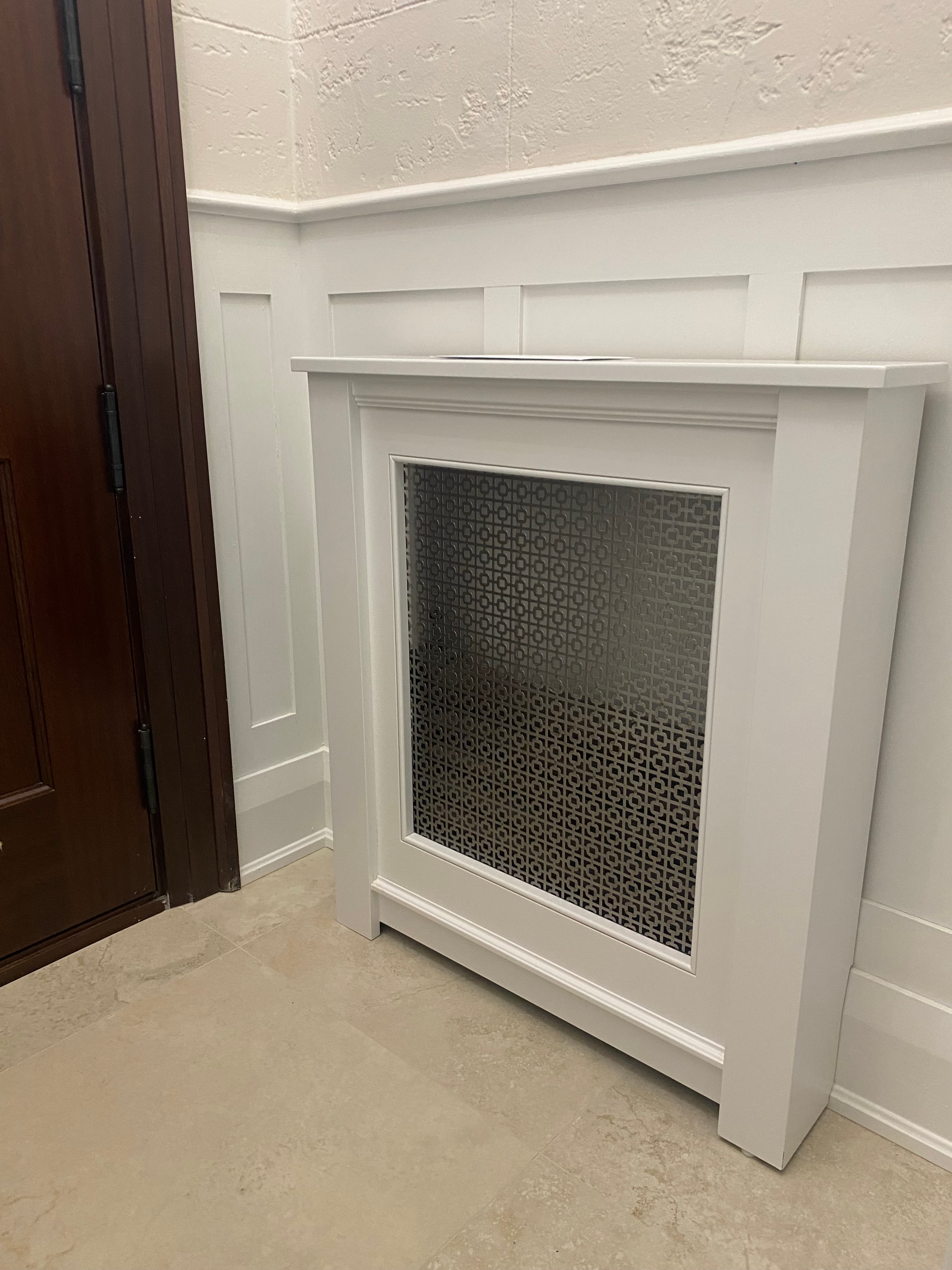 Custom radiator cover with decorative fireplace surround