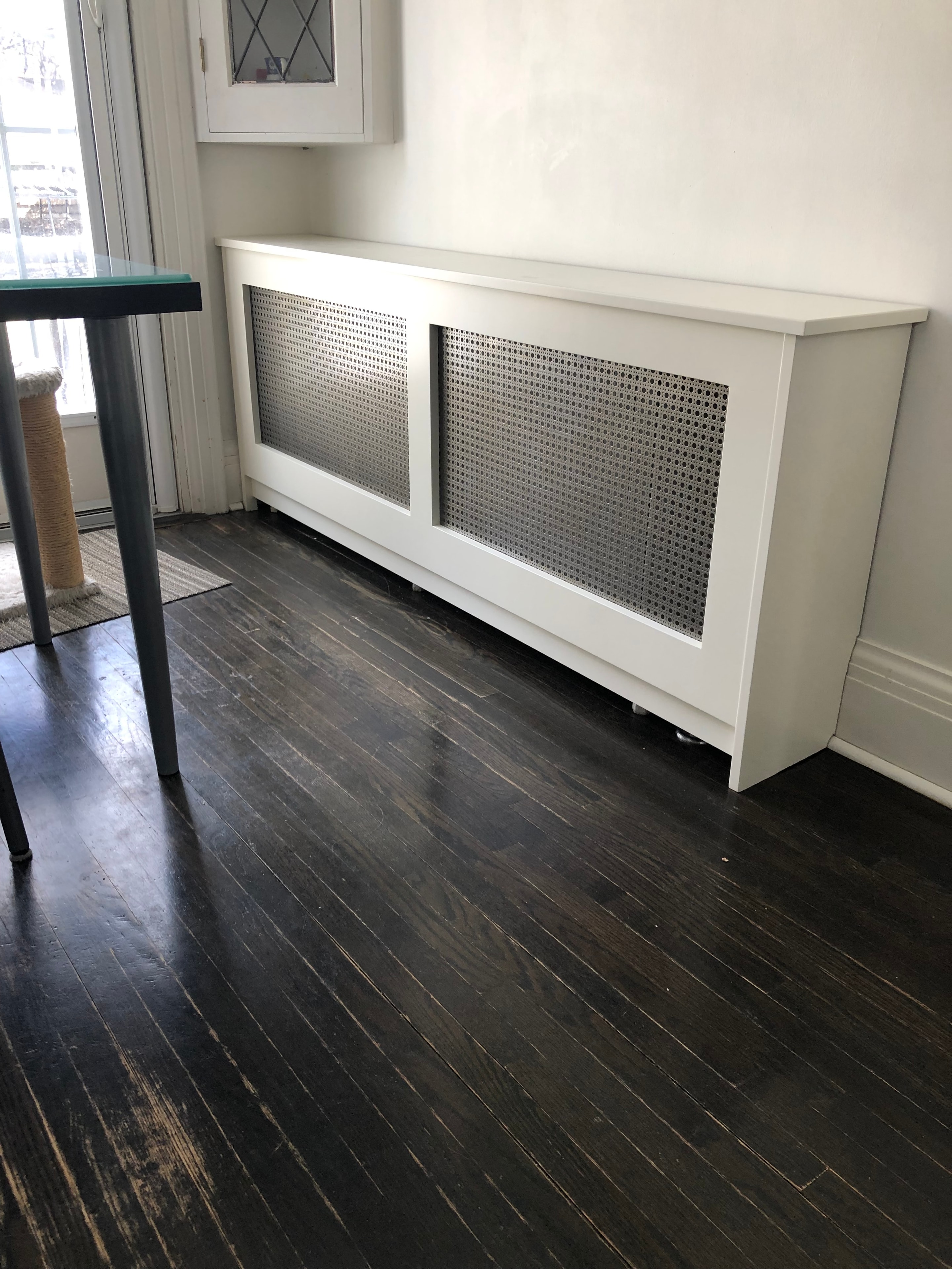White radiator cover with perforated panel detail